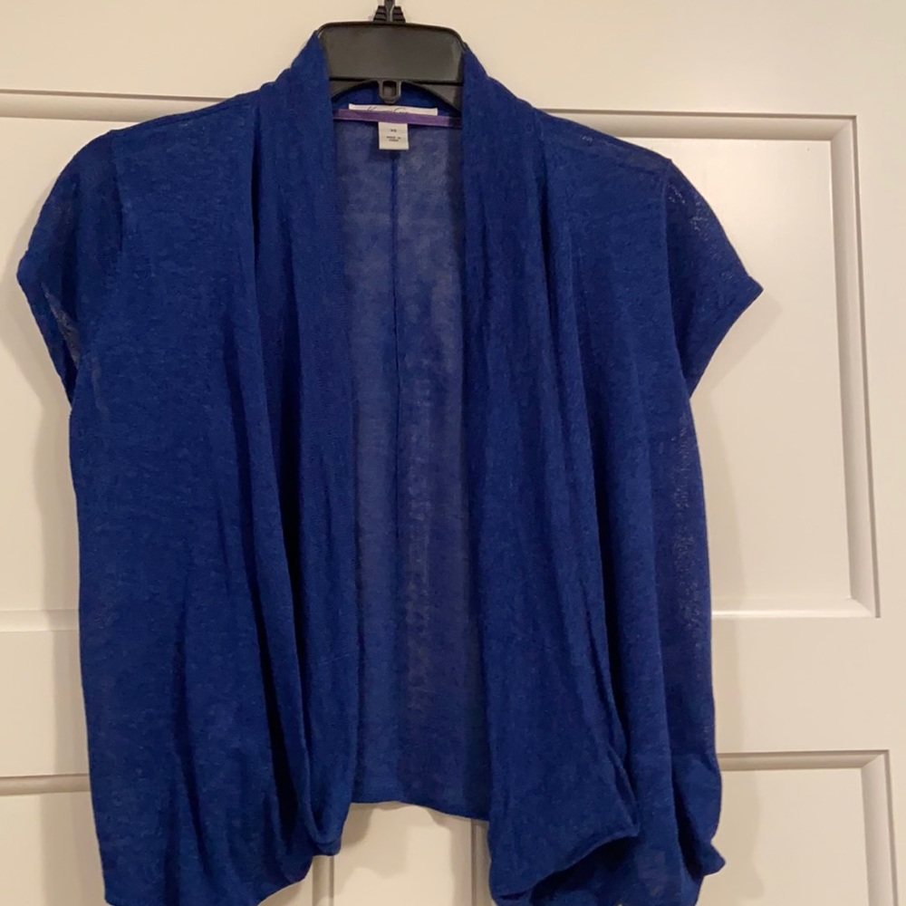 Kenneth Cole shrug.